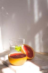 Close-up of orange juice on table