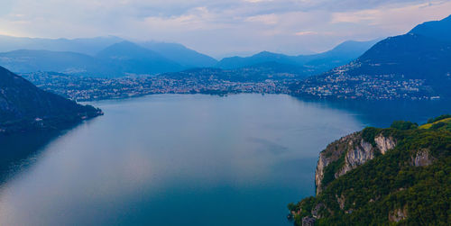 Panoramic view of sea and mountains against sky