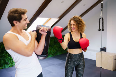 Young woman exercising in gym