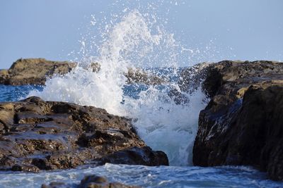 Waves splashing on rocks