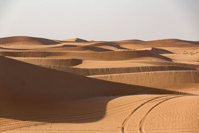 Scenic view of desert against clear sky