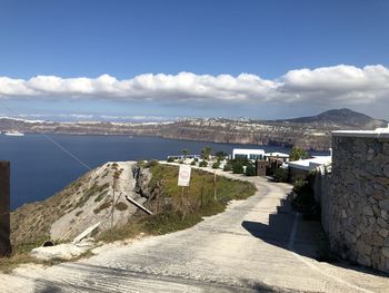 Panoramic view of city by sea against sky