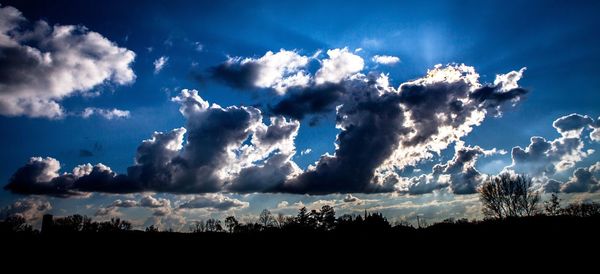 Scenic view of landscape against blue sky