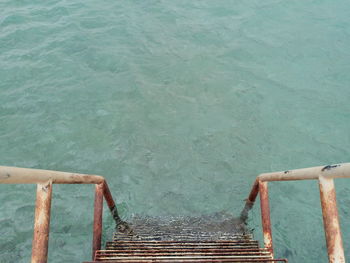 High angle view of pier by swimming pool