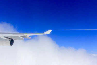 Airplane flying against sky