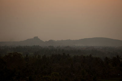 Scenic view of landscape against sky during sunset 