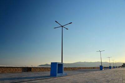 Street against clear blue sky