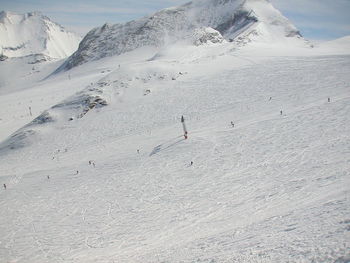 Scenic view of snowcapped mountain against sky