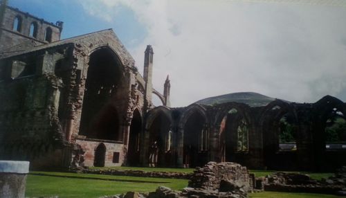 Old building against cloudy sky