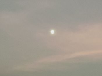 Low angle view of moon against sky at night