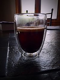 Close-up of beer in glass on table