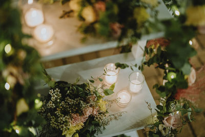 High angle view of decoration with tealight candles on table