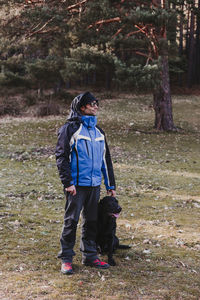 Full length of senior woman standing on land