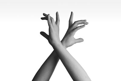 Low section of woman against white background