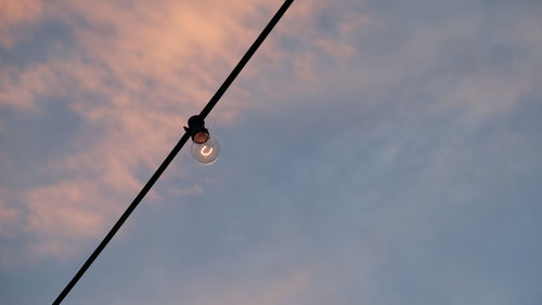 Low angle view of cable against sky