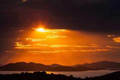 Scenic view of silhouette mountains against romantic sky at sunset, murter, croatia