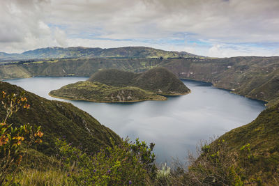 Scenic view of lake and mountains against sky