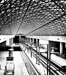 Low angle view of railroad station platform in city