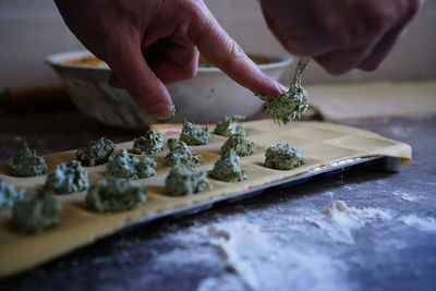 Close-up of person preparing food