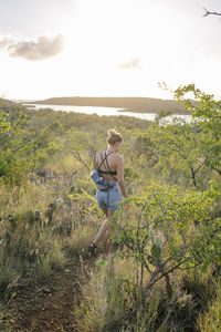 Rear view of women hiking on mountain at caribbean island curacao