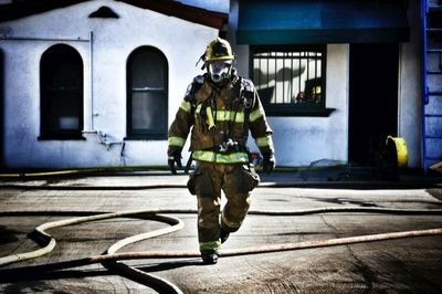 Full length of woman standing on railing