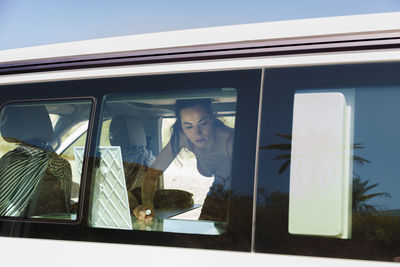 View of woman in car