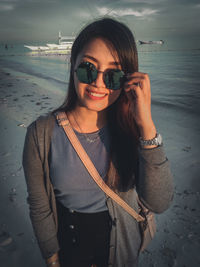 Young woman wearing sunglasses at beach