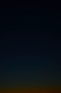 Low angle view of moon against sky at night