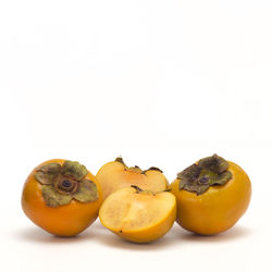 Close-up of fruits against white background