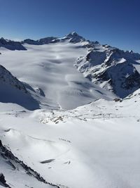 Climbers crossing an alpine glacier