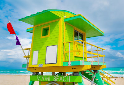 Built structure on beach against sky