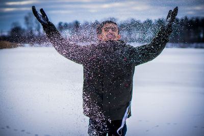 Man with umbrella in snow