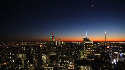 Illuminated buildings in city at night