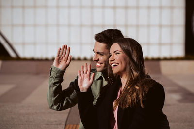 Side view of a smiling young couple
