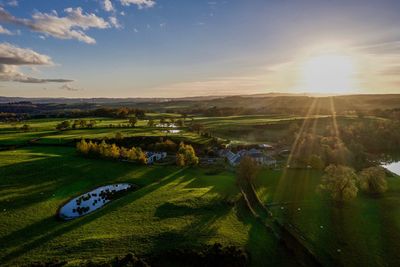 Scenic view of landscape against sky during sunset