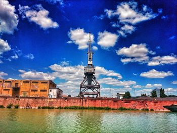 Built structure against blue sky and clouds