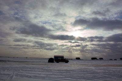 Scenic view of sea against cloudy sky