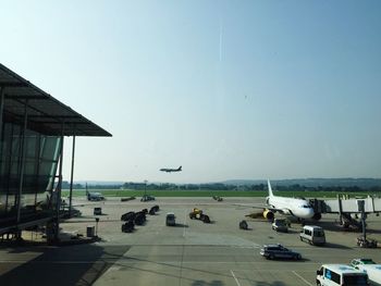 Airplane on airport runway against clear sky