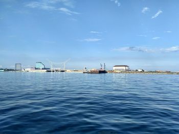 Scenic view of sea against blue sky