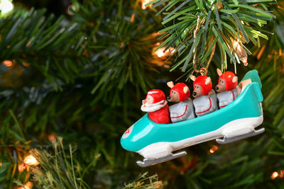 Close-up of christmas ornaments hanging on the christmas tree