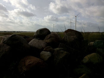 Scenic view of landscape against cloudy sky