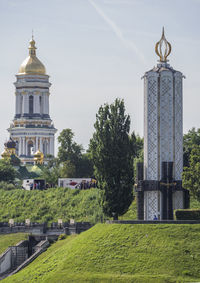 Kiev pechersk lavra or kyiv pechersk lavra and memorial monument of the holodomor victims