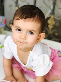Portrait of cute baby at home