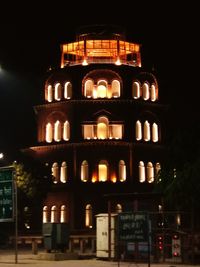 Low angle view of illuminated building at night