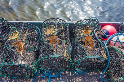 High angle view of lobster traps on boat in sea