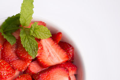 Close-up of strawberry over white background