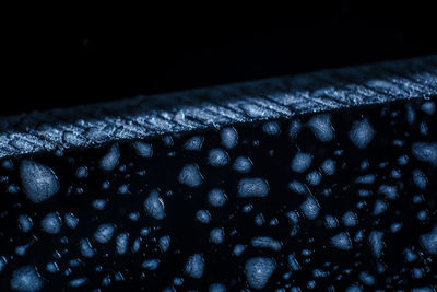 Close-up of water drops on black background