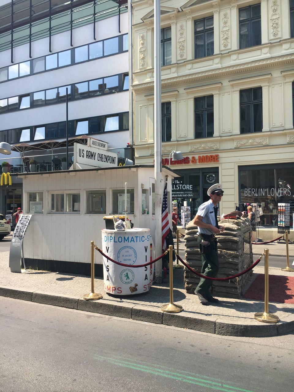 MAN ON STREET AGAINST BUILDING