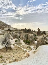 Scenic view of landscape against cloudy sky