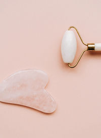 High angle view of dentures on pink background